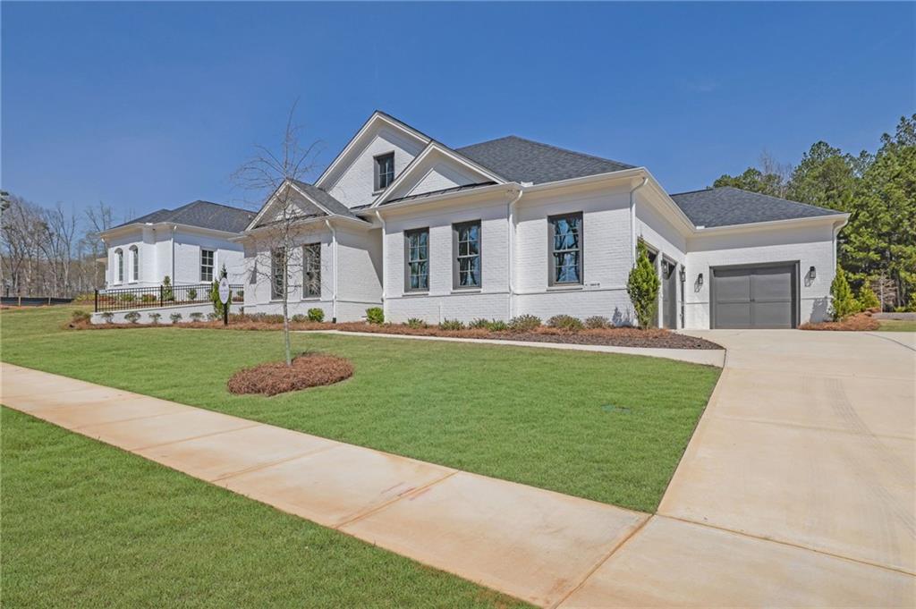 123 Candler Loop Acworth, GA 30101 - Photo 3 of 34 a front view of a house with a garden