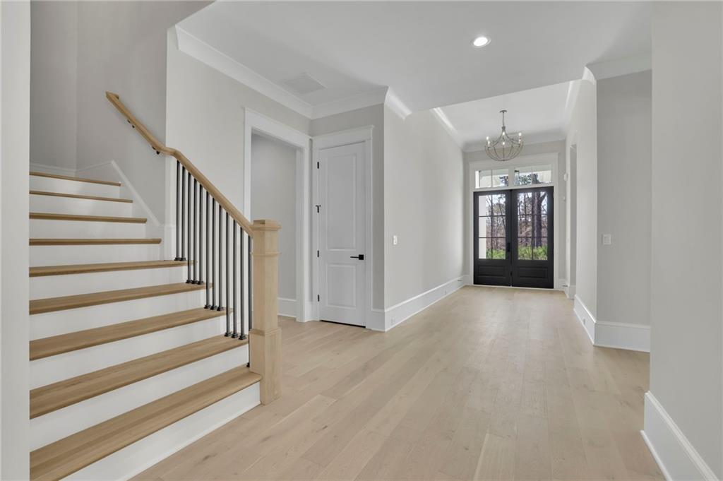 123 Candler Loop Acworth, GA 30101 - Photo 6 of 34 a view of a hallway with wooden floor and entryway