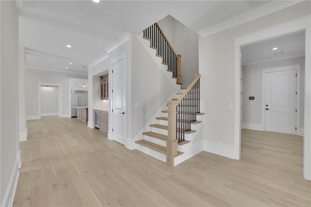 123 Candler Loop Acworth, GA 30101 - Photo 7 of 34 a view of entryway with wooden floor and stairs