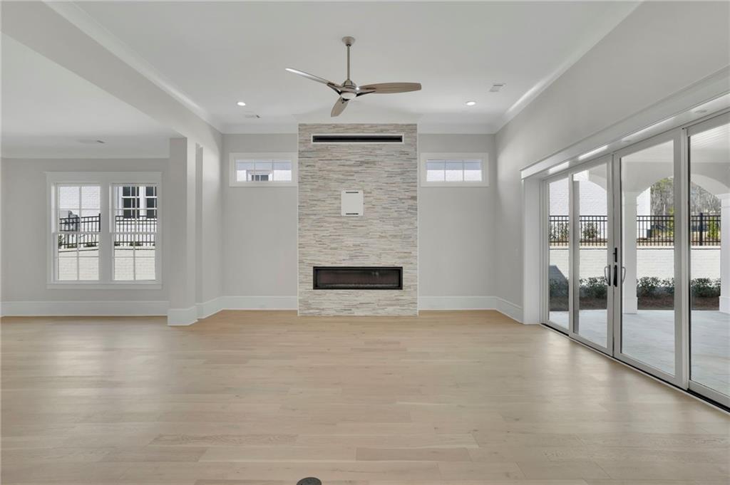 123 Candler Loop Acworth, GA 30101 - Photo 9 of 34 a view of an empty room with glass door and windows
