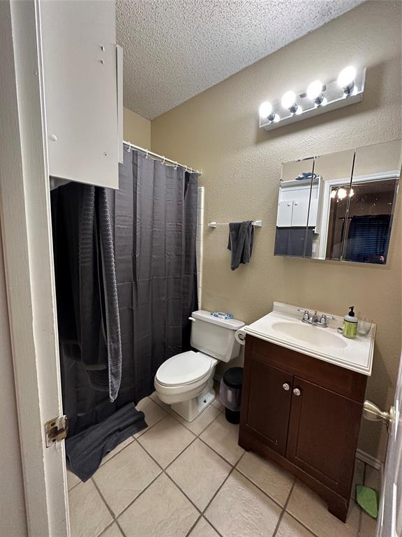 2414 Longview Street, Unit 301 Austin, TX 78705 - Photo 11 of 15 a bathroom with a sink toilet and shower