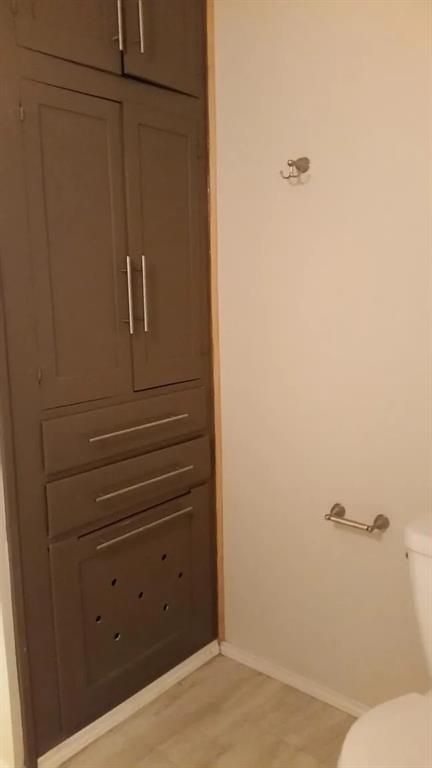 304 Fulton Street, Unit A Denton, TX 76201 - Photo 11 of 17 a bathroom with a bathtub