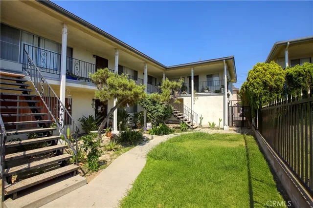 a front view of house with yard and outdoor seating