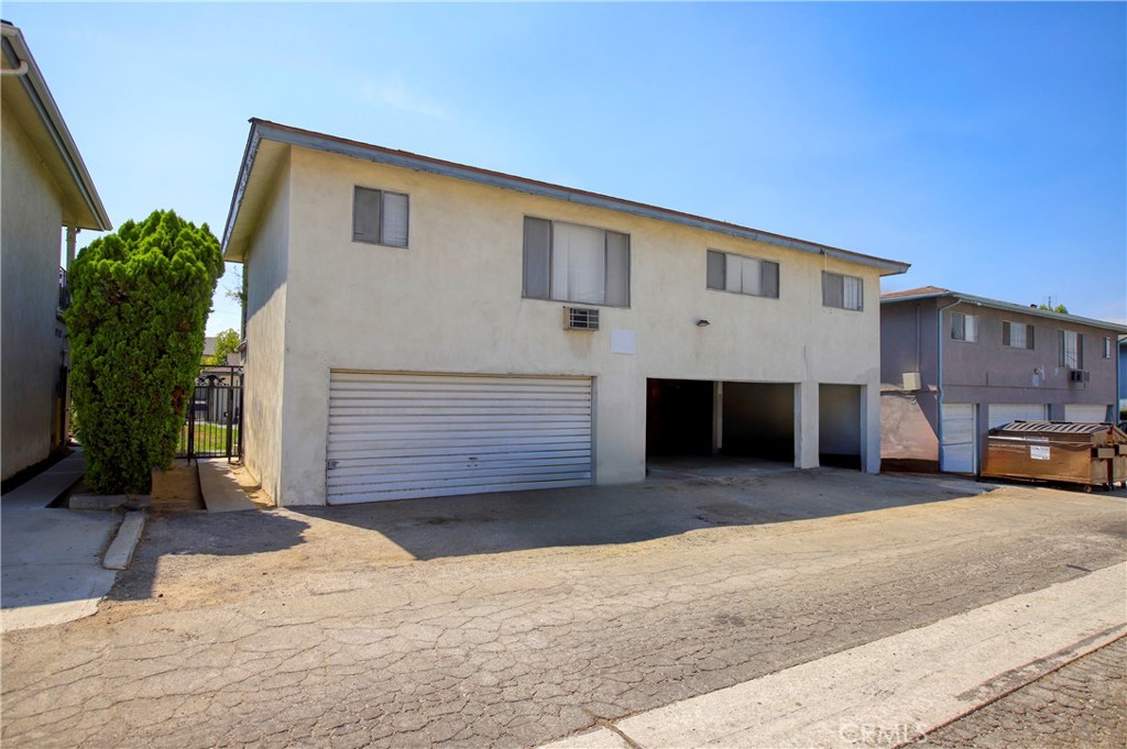 12406 Clearglen Avenue Whittier, CA 90604 - Photo 6 of 7 a front view of a house with a yard and garage