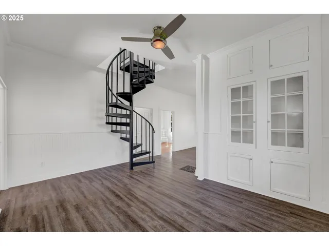 a view of an entryway with wooden floor