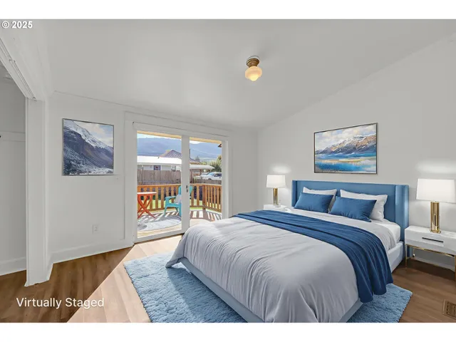 a view of an empty room and wooden floor