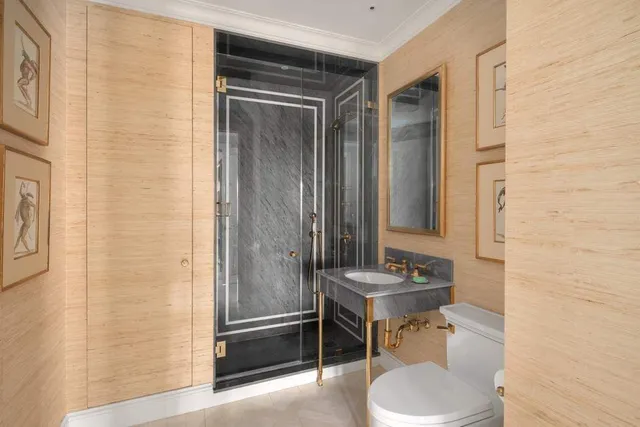 a living room with furniture and a lamp