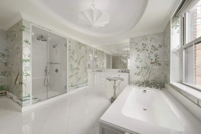 a bathroom with a bathtub sink and a shower