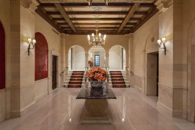 a bedroom with a bed and glass windows