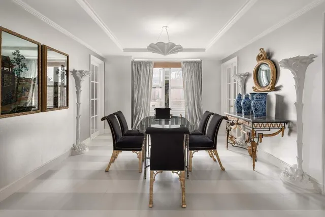 a living room with furniture and a lamp