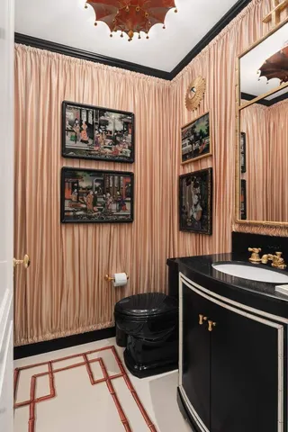 a large white kitchen with a large window