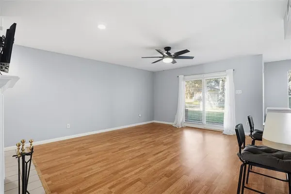 a kitchen that has a table and chairs in it