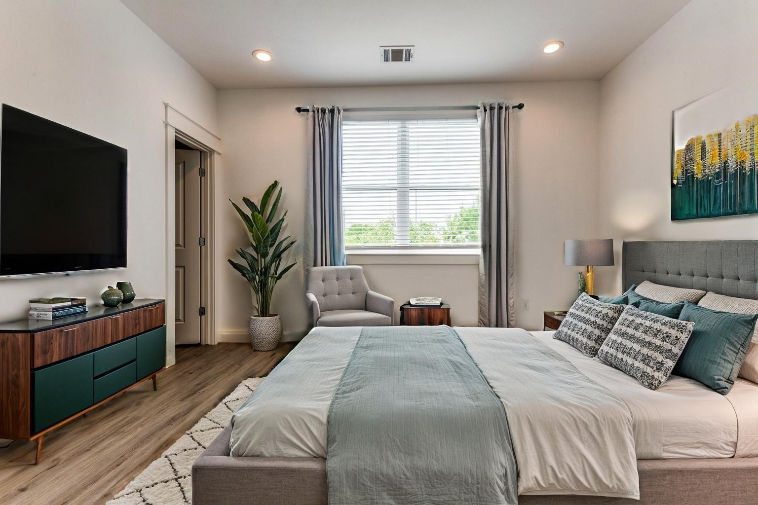728 East 38th Street Houston, TX 77022 - Photo 14 of 18 Spacious secondary bedrooms featue LVP flooring and a walk-in closets for added comfort and storage. *virtually staged*