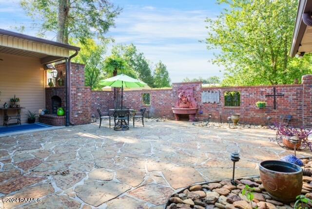 222 Fire Willow Trail Sunset, LA 70584 - Photo 26 of 46 Large patio/ courtyard with fountain