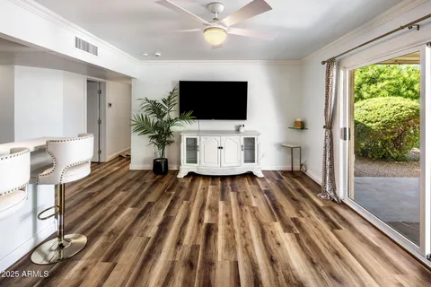 a bedroom with a bed and windows