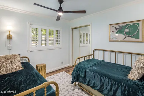 a bathroom with a granite countertop sink a toilet and a mirror
