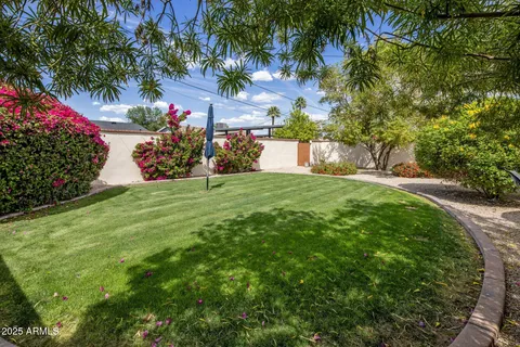 a view of a backyard with garden