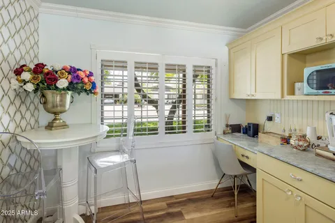 a kitchen with a sink and a stove top oven
