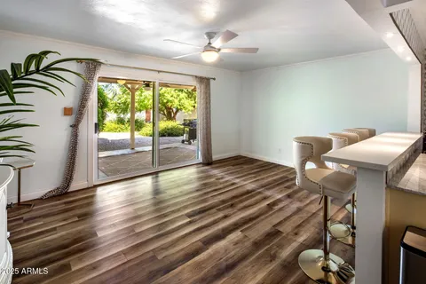 a living room with a flat screen tv and a fireplace