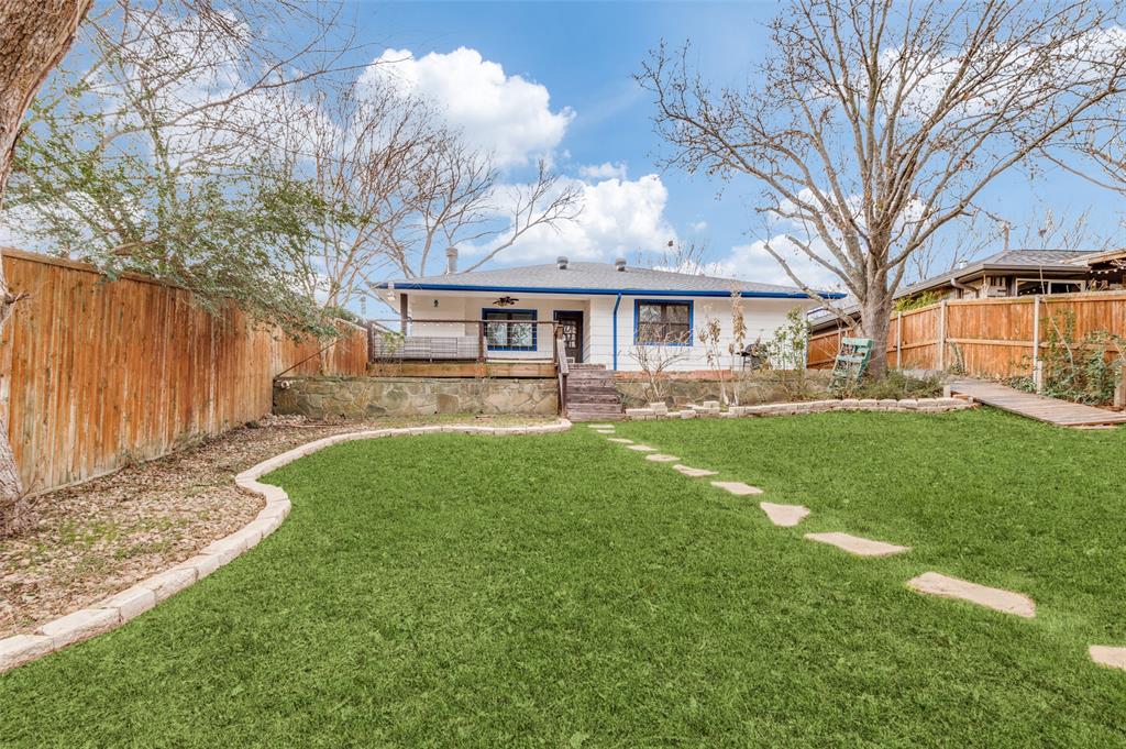 2749 Buna Drive Dallas, TX 75211 - Photo 12 of 12 a view of house in front of a big yard with large trees