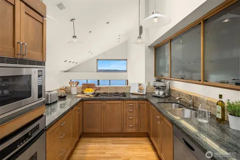 a kitchen with lots of counter top space and a sink