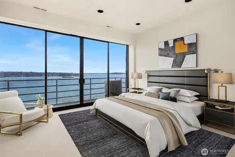 a bedroom with a bed and glass window