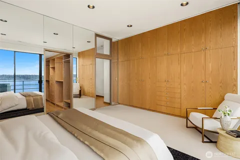 a spacious bedroom with a bed and a couch