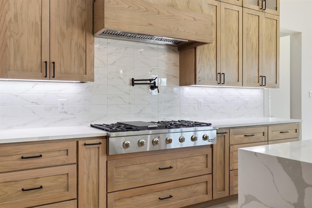 150 Briar Patch Azle, TX 76020 - Photo 11 of 40 a stove top oven sitting inside of a kitchen