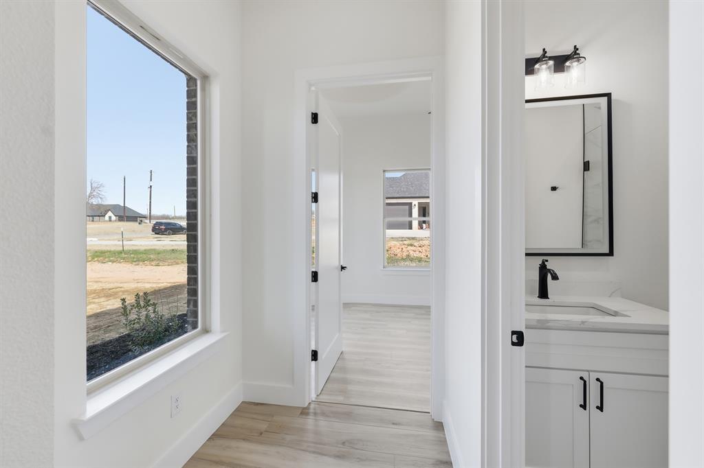 150 Briar Patch Azle, TX 76020 - Photo 13 of 40 a bathroom with a sink and a mirror