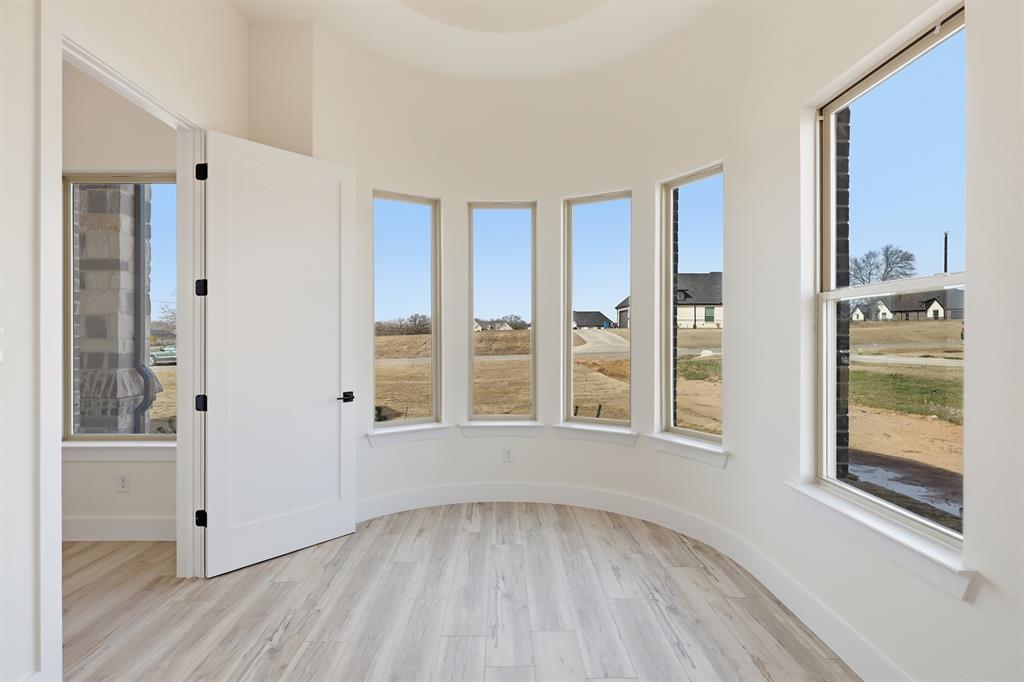 150 Briar Patch Azle, TX 76020 - Photo 15 of 40 4th bedroom with curved windows facing front of home.