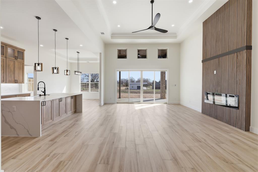150 Briar Patch Azle, TX 76020 - Photo 16 of 40 Living room with 13' tiered ceilings accented with LED lighting.