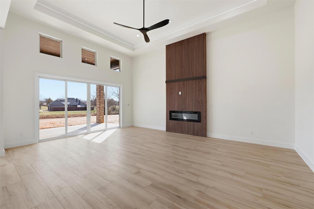150 Briar Patch Azle, TX 76020 - Photo 18 of 40 a view of an empty room with a window and wooden floor