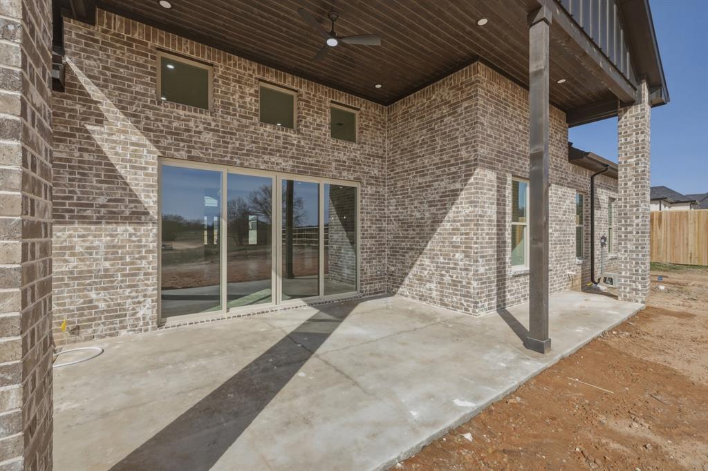 150 Briar Patch Azle, TX 76020 - Photo 19 of 40 a view of a brick house with large windows