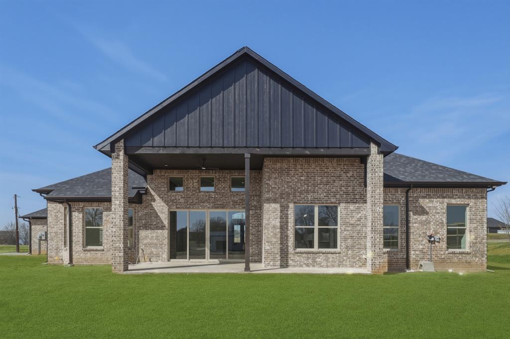 150 Briar Patch Azle, TX 76020 - Photo 21 of 40 a front view of a house with a yard