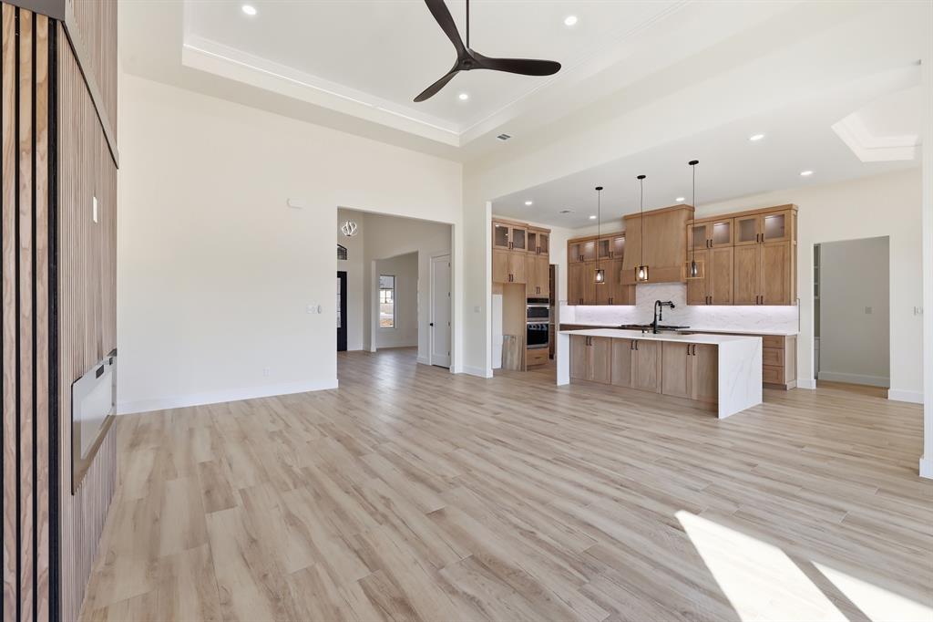 150 Briar Patch Azle, TX 76020 - Photo 21 of 40 Open concept kitchen, living, and breakfast rooms.