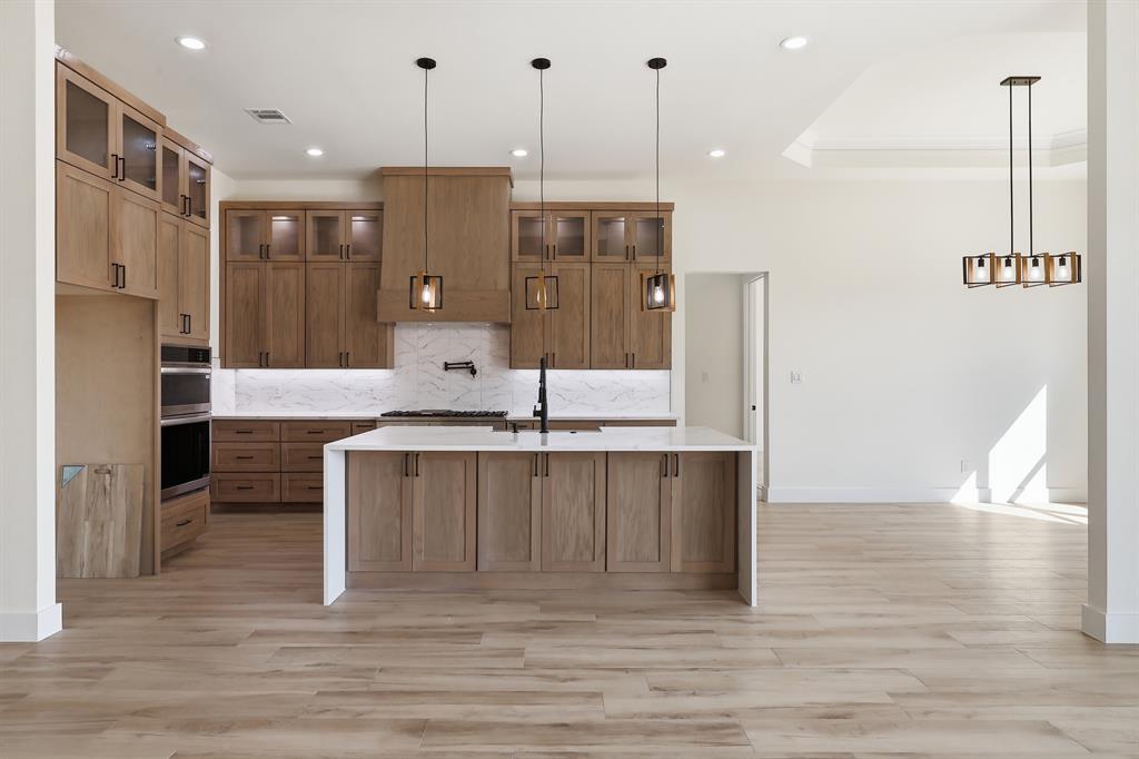 150 Briar Patch Azle, TX 76020 - Photo 23 of 40 Gorgeous kitchen with cabinets to ceilings and glass uppers!