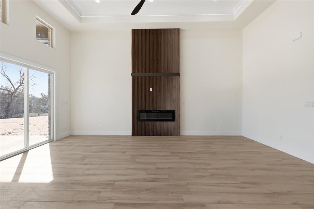150 Briar Patch Azle, TX 76020 - Photo 23 of 40 a view of empty room with wooden floor and fan