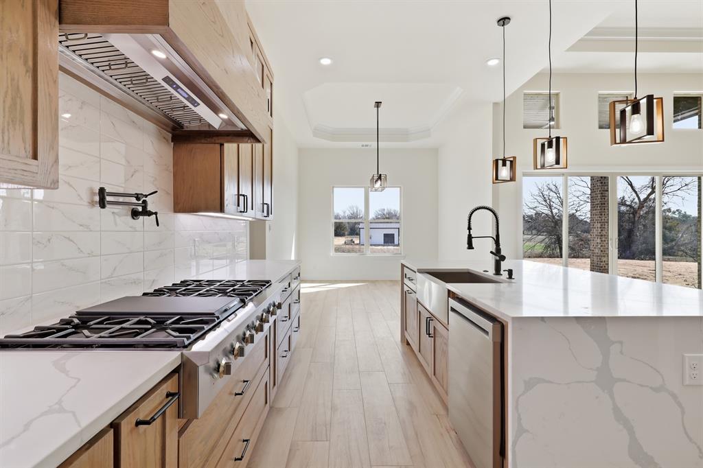 150 Briar Patch Azle, TX 76020 - Photo 24 of 40 Gas range with pot filler. Look at that waterfall island!