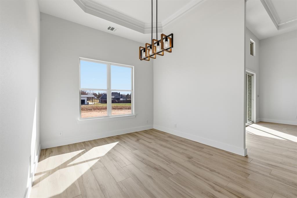 150 Briar Patch Azle, TX 76020 - Photo 27 of 40 a view of a room with a window and wooden floor