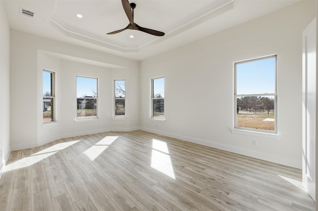 150 Briar Patch Azle, TX 76020 - Photo 29 of 40 a view of an empty room with wooden floor and a window
