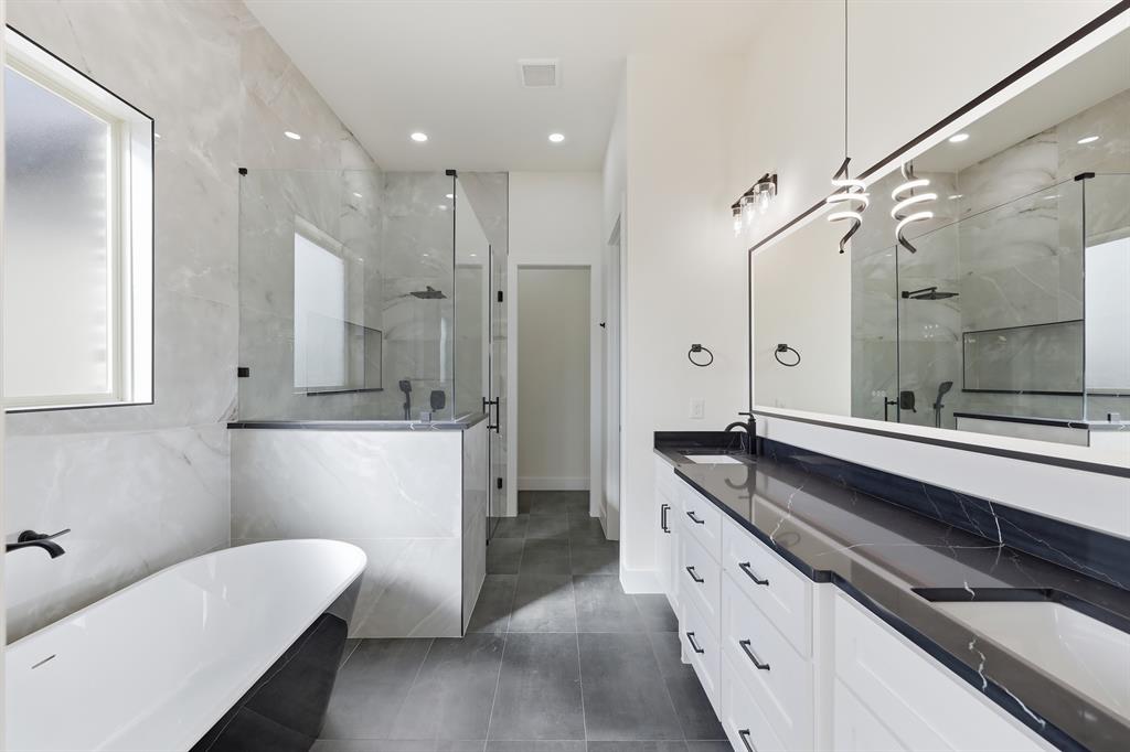 150 Briar Patch Azle, TX 76020 - Photo 31 of 40 a spacious bathroom with a granite countertop sink a toilet a mirror and shower