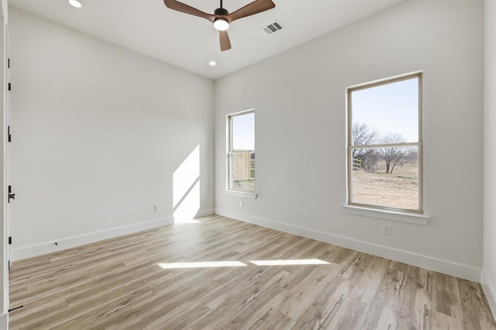 150 Briar Patch Azle, TX 76020 - Photo 40 of 40 a view of an empty room with wooden floor and a window