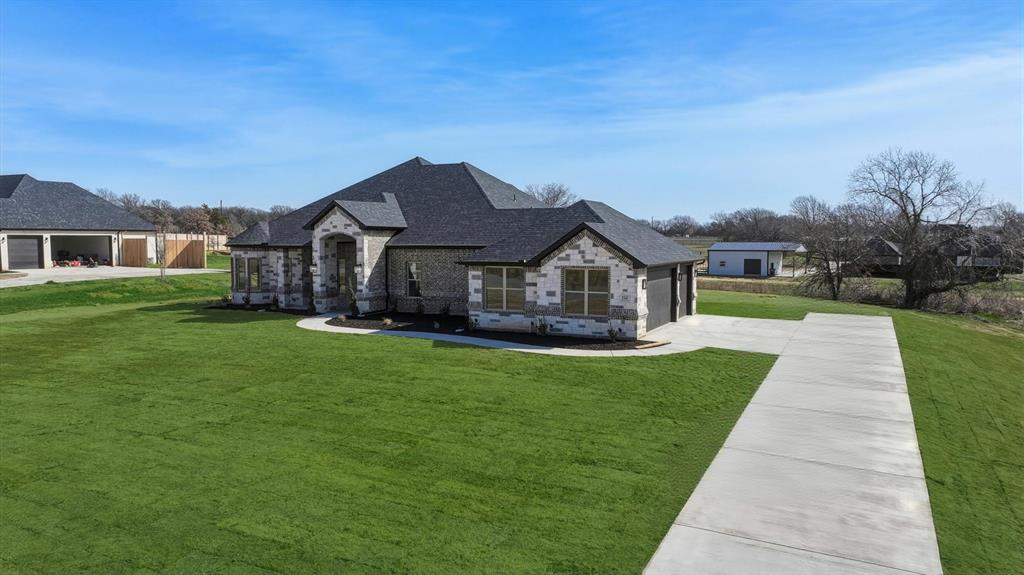 150 Briar Patch Azle, TX 76020 - Photo 4 of 40 a front view of house with yard and green space