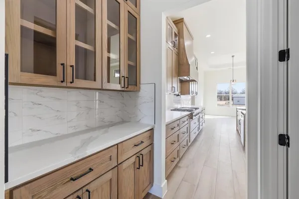 a stove top oven sitting inside of a kitchen