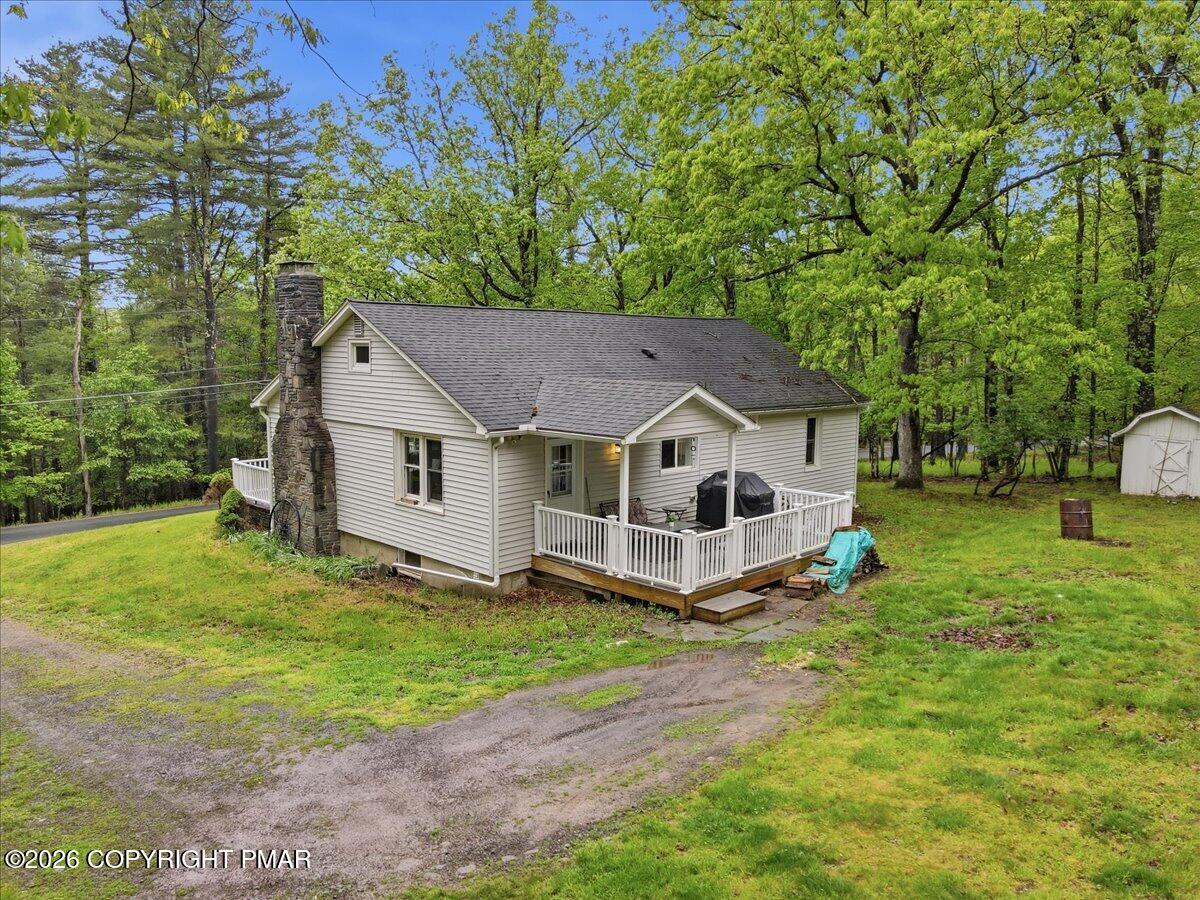 232 Garrity Road Hawley, PA 18428 - Photo 3 of 57 a house with a tree in front of it