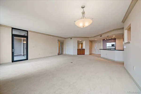 a view of a room with chandelier and windows