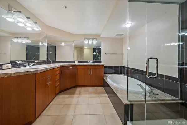 a large kitchen with kitchen island a large counter tops and a view of living room