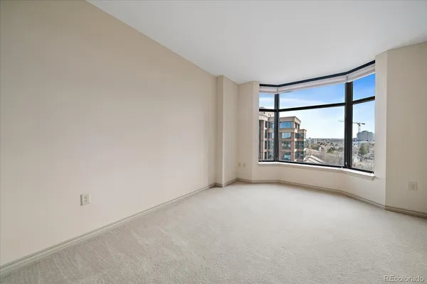 an empty room with windows and view