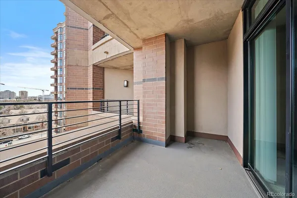 a view of a balcony with a ceiling fan