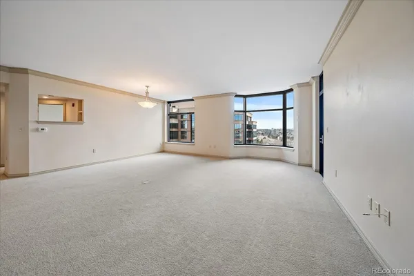 a view of a big room with windows and cabinet